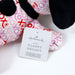 Plush toy with 'Hallmark' tag on a white background