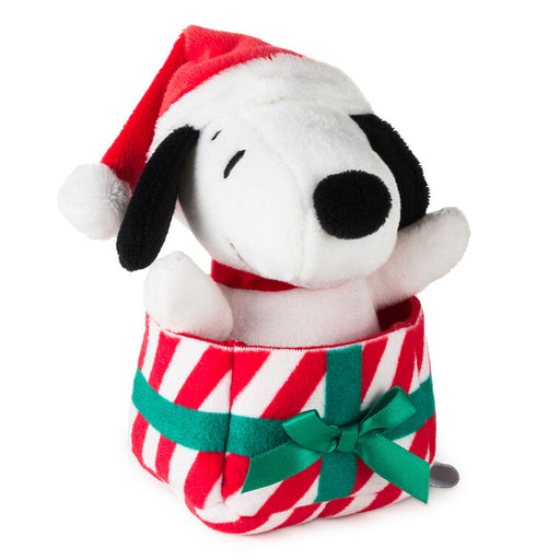 Plush toy resembling a dog in a Santa hat and candy cane outfit on a white background