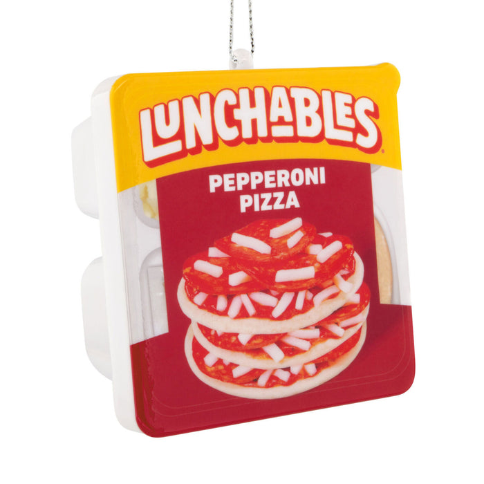 A novelty Christmas ornament shaped like a packaged Lunchables Pepperoni Pizza, featuring the Lunchables logo, a red and white pepperoni pizza graphic, and a silver hanging loop at the top.
