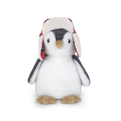 Stuffed penguin toy wearing a plaid hat on a white background