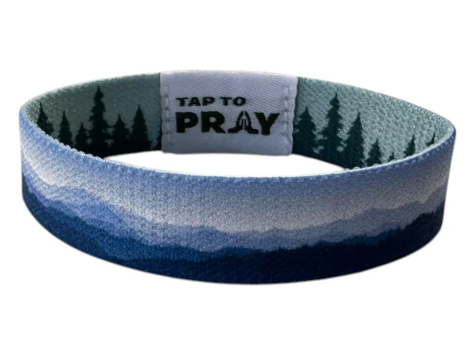 Wristband with nature design and 'Tap to Pray' text on a white background