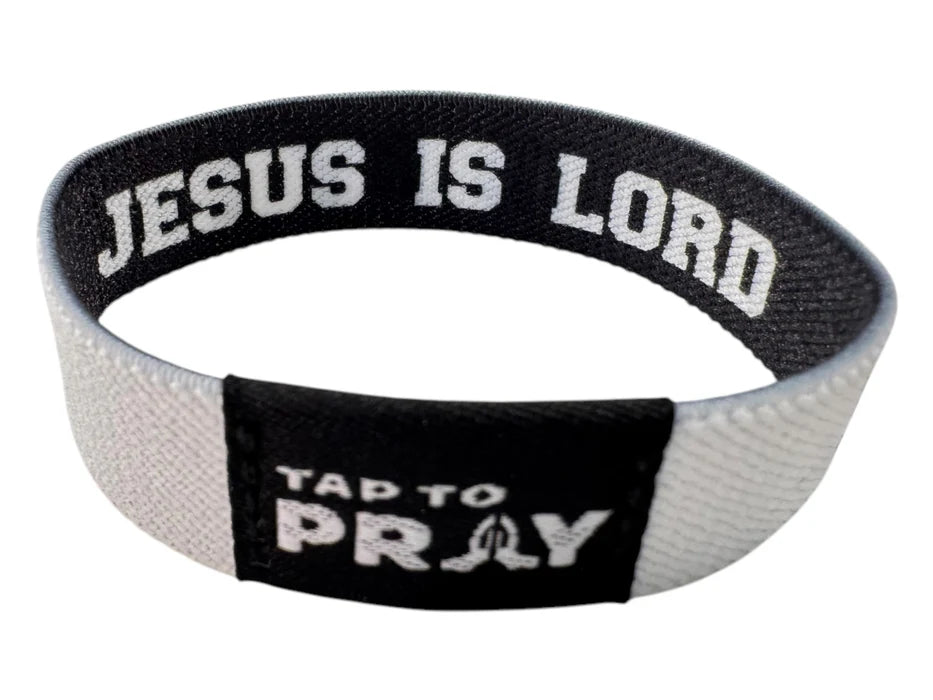 Wristband with 'Jesus is Lord' text on a white background