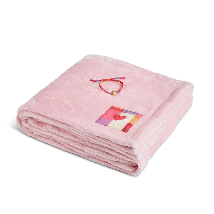 Pink blanket with a colorful heart design on a white background