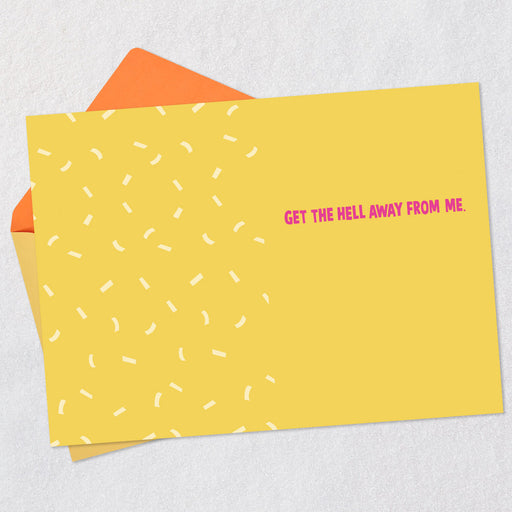 Yellow card with white pattern and pink text 'GET THE HELL AWAY FROM ME' on a light gray background