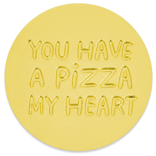 A round gold token with the phrase 'YOU HAVE A PIZZA MY HEART' embossed in raised letters, shown on a plain white background.