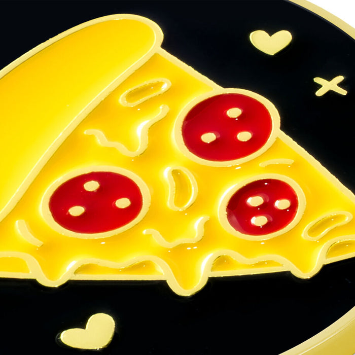 A close-up of a glossy enamel pin shaped like a slice of pizza on a black background, with yellow cheese, red pepperoni, and small gold heart and cross details.