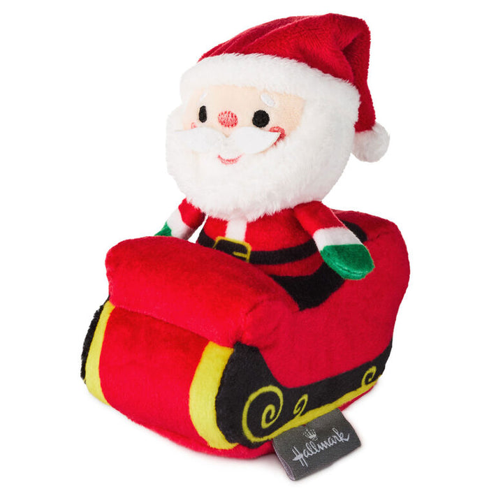 Plush toy resembling Santa Claus with a tag on a white background