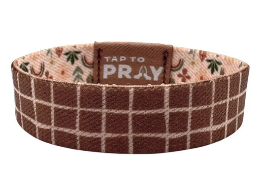 Brown plaid bracelet with 'Tap to Pray' text on a white background