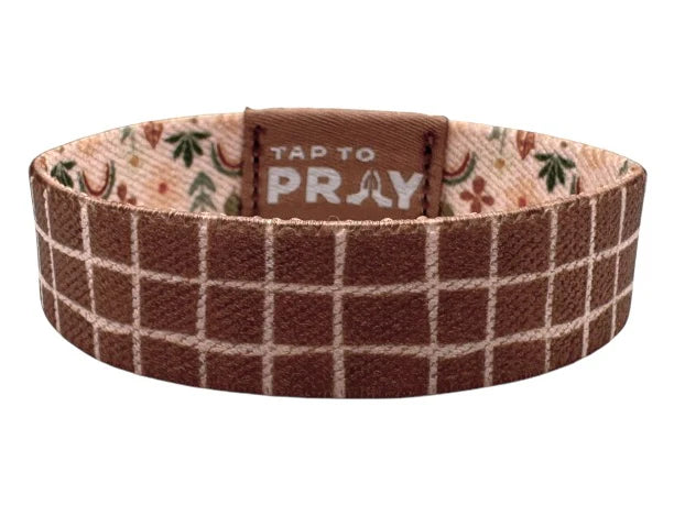 Brown plaid bracelet with 'Tap to Pray' text on a white background