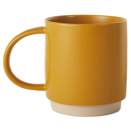 Yellow mug with a beige base on a white background