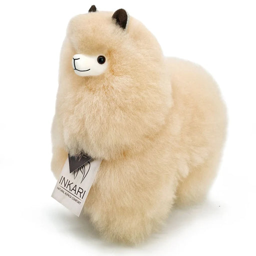 Plush toy llama with a visible Inkari tag on a white background