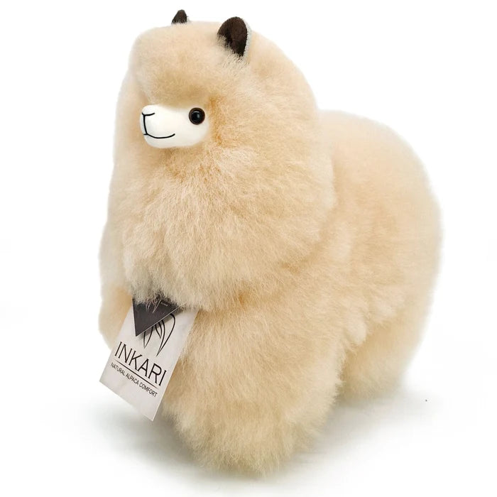 Plush toy llama with a visible Inkari tag on a white background