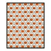 A rectangular area rug with a repeating Halloween pattern of orange jack-o'-lantern pumpkins and black vines on an off-white background, finished with a black border.