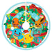 Circular design with cartoon characters in a festive setting, featuring a Christmas tree and presents.