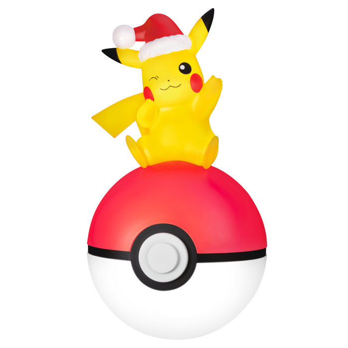 Pikachu character on a Poké Ball with a Santa hat on a white background