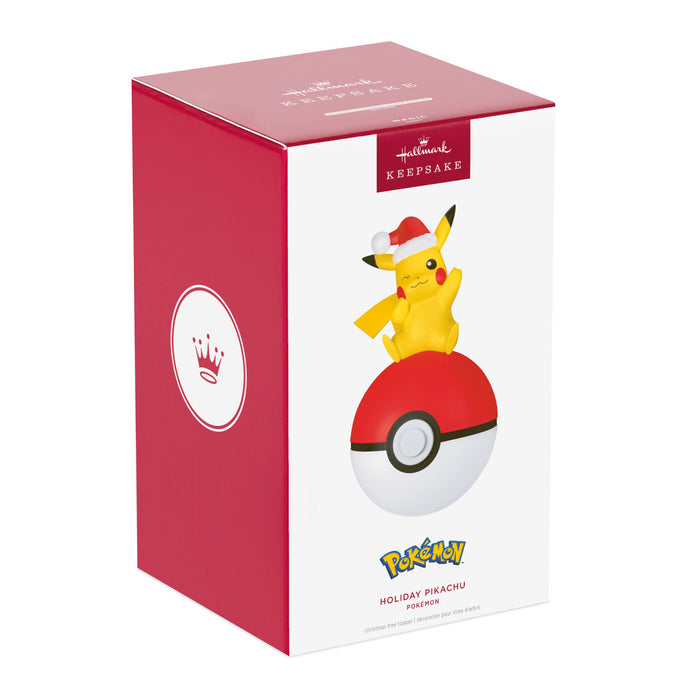 Pokémon Holiday Pikachu figurine in a red and white box with a Poké Ball on a white background