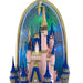 Fantasy castle with blue spires and fireworks in the background
