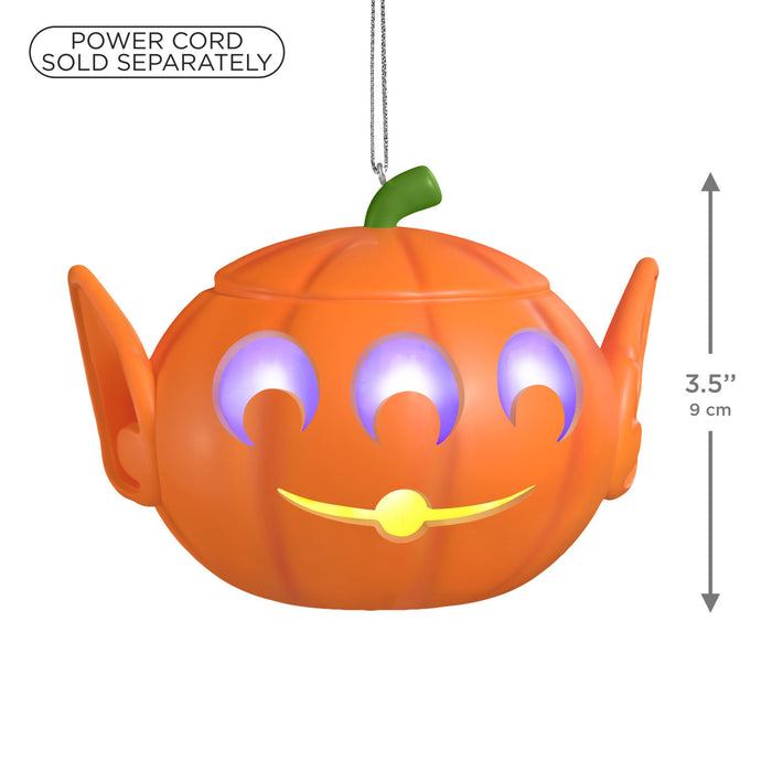 Halloween pumpkin-shaped lantern with glowing eyes and mouth on a white background