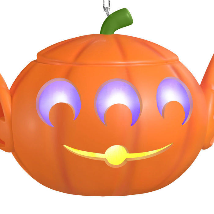 Pumpkin-shaped lantern with glowing eyes and mouth on a white background