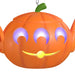 Pumpkin-shaped lantern with glowing eyes and mouth on a white background