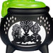 Black cauldron with green lid featuring silhouettes of three women on a white background