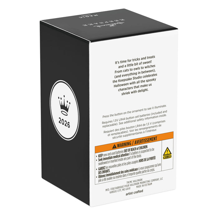 Black and white packaging box with text and a warning label on a white background