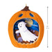 Halloween ornament shaped like a pumpkin with a ghost inside, on a white background.