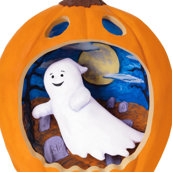 Pumpkin with a ghost inside, set against a Halloween-themed background