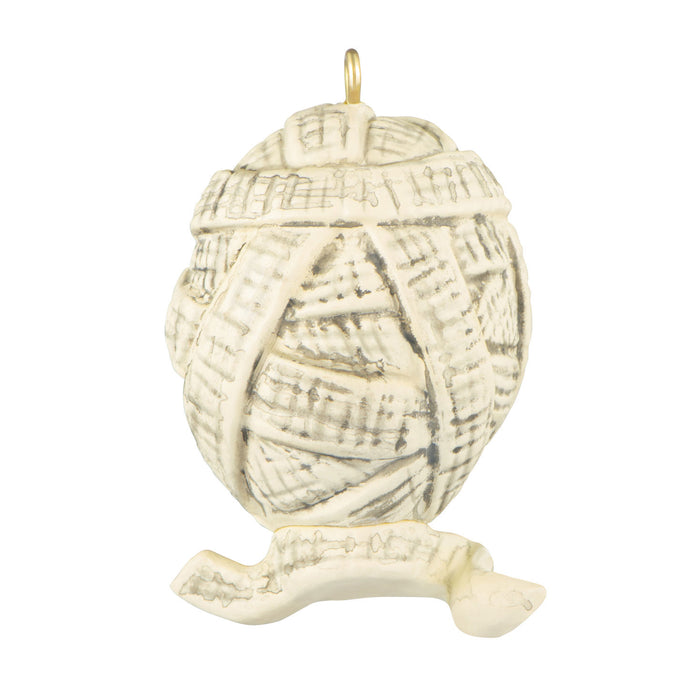 Decorative shell ornament with a textured surface on a white background