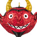 Red glittery monster ornament with yellow horns on a white background