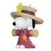 Snoopy figurine in a scarecrow costume with Woodstock on top, on a white background