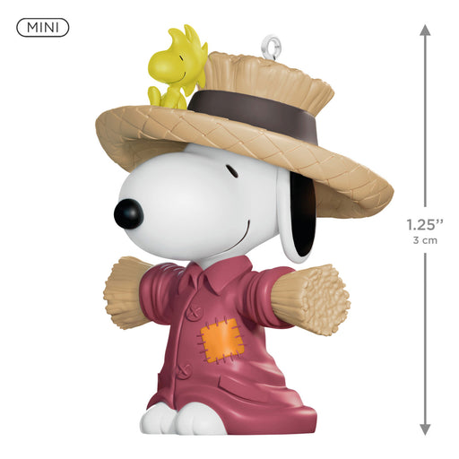Scarecrow-themed Snoopy figurine with Woodstock on a white background