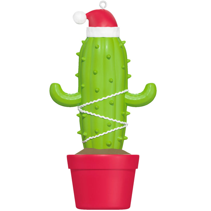 Cactus-shaped ornament with a Santa hat on a white background