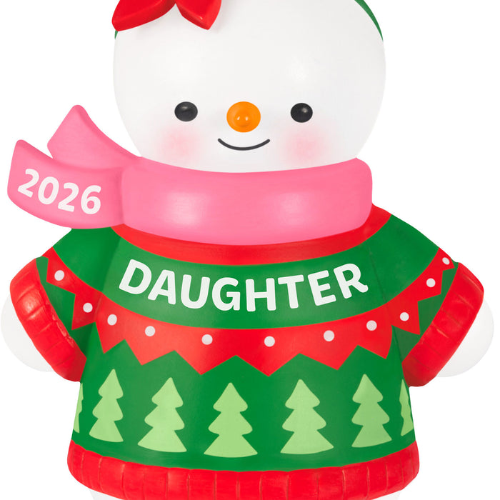 Snowman ornament wearing a green sweater with 'DAUGHTER' printed on it, pink scarf, and red hat with '2026' on a white background.