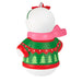 Decorative Christmas snowman ornament with a pink scarf and green sweater with tree pattern on a white background.