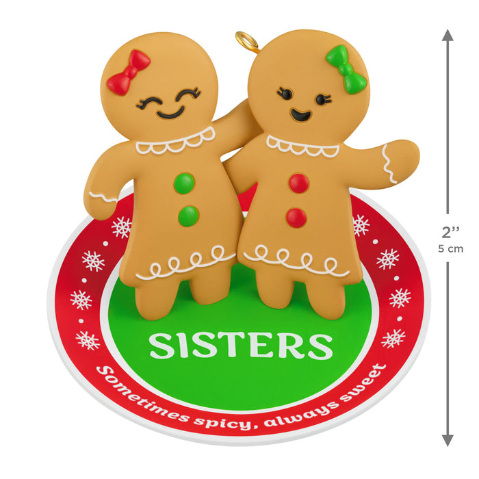 Gingerbread sister ornament with decorative text on a white background