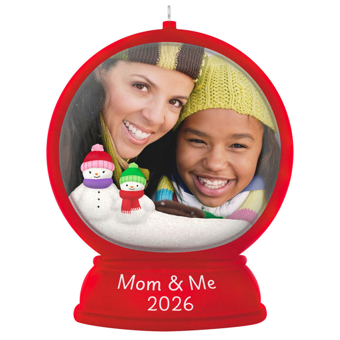 Decorative ornament with a photo of a woman and child, snowmen, and 'Mom & Me 2026' text.