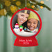 Christmas ornament with a photo of a woman and a child, snowmen, and 'Mom & Me 2026' text, hanging on a decorated tree.
