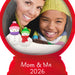 Two people with snowmen and a red border labeled 'Mom & Me 2026'.