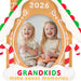Two children with drinks inside a gingerbread house frame with '2026 Grandkids make sweet memories' text.