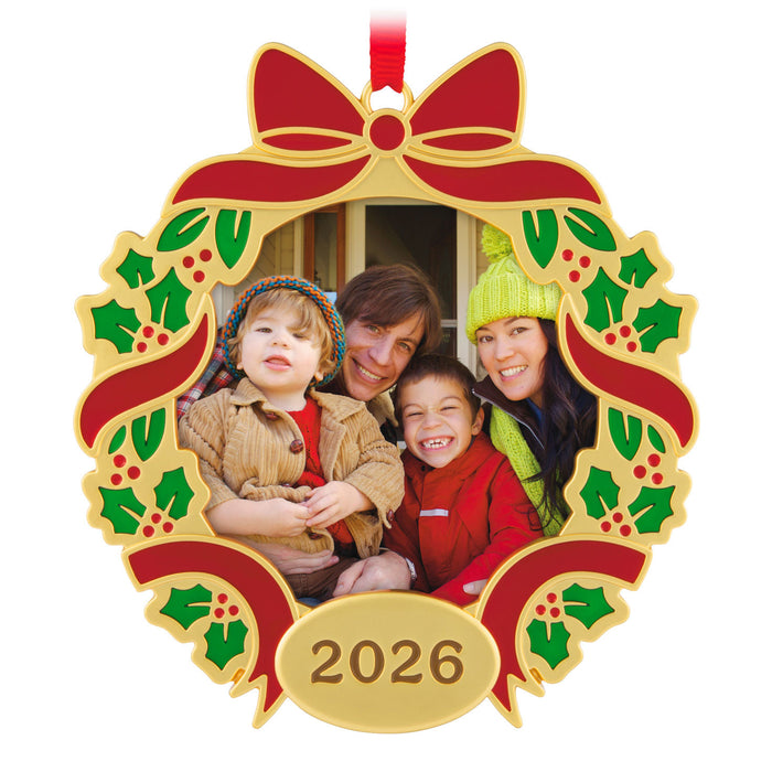 Decorative Christmas ornament with a family photo and '2026' on a white background