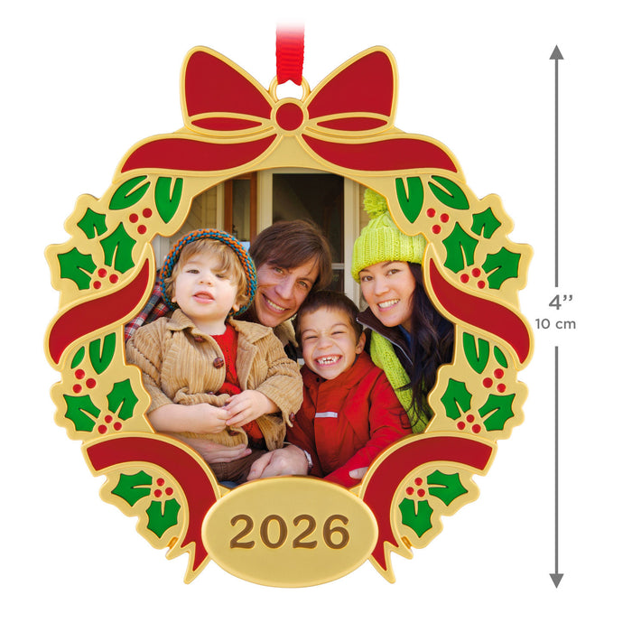 Decorative Christmas ornament with a family photo and '2026' on a white background