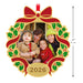Decorative Christmas ornament with a family photo and '2026' on a white background
