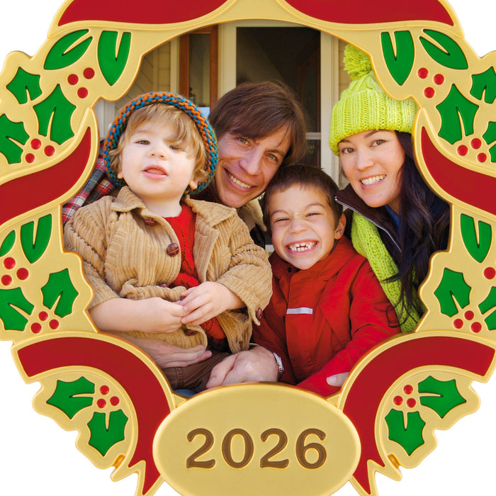 Family photo ornament with a decorative frame featuring holly leaves and berries, and the year 2026.