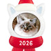 Cat-shaped Christmas ornament with a picture of a cat, red scarf, and Santa hat labeled '2026' on a white background
