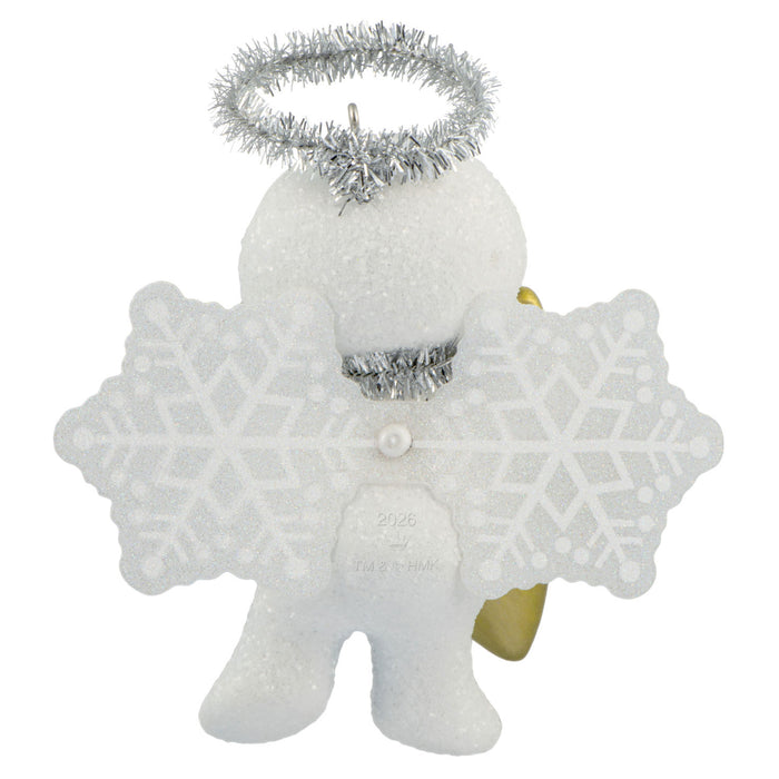 White angel ornament with snowflake wings and silver halo on a white background