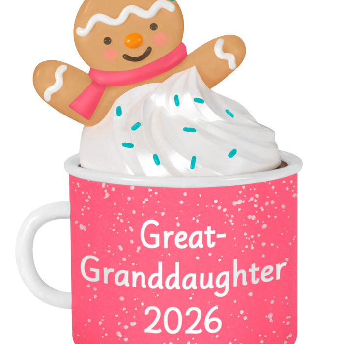 Pink mug with 'Great-Granddaughter 2026' text, topped with a gingerbread man and whipped cream.