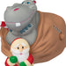 Hippopotamus with a Santa Claus figure inside a bag on a white background