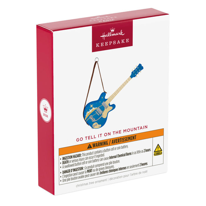 Hallmark Keepsake Christmas ornament packaging with blue guitar design on a white background