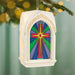 Decorative ornament with stained glass design on a blurred green background